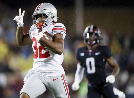 Ohio State Buckeyes running back TreVeyon Henderson (32) scores a touchdown after a catch against Minnesota Golden Gophers during the fourth quarter of their game in Huntington Bank Stadium at University of Minnesota in Minneapolis, MN on September 2, 2021.

Ceb Osu21min Kwr 47