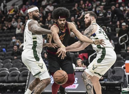 Dec 18, 2021; Milwaukee, Wisconsin, USA;  Cleveland Cavaliers center Jarrett Allen (31) reaches for the ball against Milwaukee Bucks center DeMarcus Cousins (15) and forward Sandro Mamukelashvili (54) in the fourth quarter at Fiserv Forum. Mandatory Credit: Benny Sieu-USA TODAY Sports