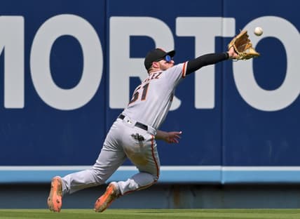 Sep 7, 2022; Los Angeles, California, USA;  San Francisco Giants right fielder Luis Gonzalez (51) makes a catch off a ball hit by Los Angeles Dodgers third baseman Miguel Vargas (not pictured) in the fourth inning at Dodger Stadium. Mandatory Credit: Jayne Kamin-Oncea-USA TODAY Sports