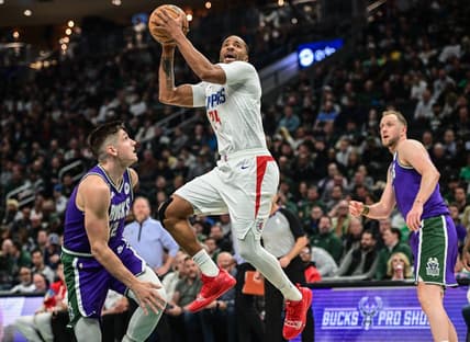 Feb 2, 2023; Milwaukee, Wisconsin, USA; Los Angeles Clippers guard Norman Powell (24) shoots against Milwaukee Bucks guard Grayson Allen (12) in the second quarter at Fiserv Forum. Mandatory Credit: Benny Sieu-USA TODAY Sports