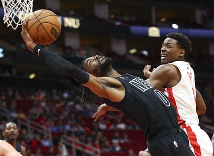 Mar 7, 2023; Houston, Texas, USA; Brooklyn Nets center Nerlens Noel (0) attempts to grab a rebound away from Houston Rockets forward Jae'Sean Tate (8) during the first quarter at Toyota Center. Mandatory Credit: Troy Taormina-USA TODAY Sports