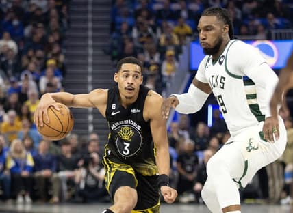 Mar 11, 2023; San Francisco, California, USA; Golden State Warriors guard Jordan Poole (3) dribbles the ball around Milwaukee Bucks forward Jae Crowder (99) during the first quarter at Chase Center. Mandatory Credit: D. Ross Cameron-USA TODAY Sports
