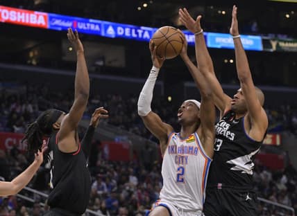 Mar 23, 2023; Los Angeles, California, USA; Oklahoma City Thunder guard Shai Gilgeous-Alexander (2) shoots between Los Angeles Clippers guard Terance Mann (14) and forward Nicolas Batum (33) in the second half at Crypto.com Arena. Mandatory Credit: Jayne Kamin-Oncea-USA TODAY Sports