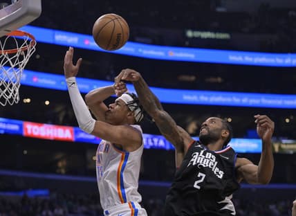 Mar 23, 2023; Los Angeles, California, USA; Los Angeles Clippers forward Kawhi Leonard (2) knocks the ball from Oklahoma City Thunder forward Ousmane Dieng (13) as he goes up for a shot in the second half at Crypto.com Arena. Mandatory Credit: Jayne Kamin-Oncea-USA TODAY Sports