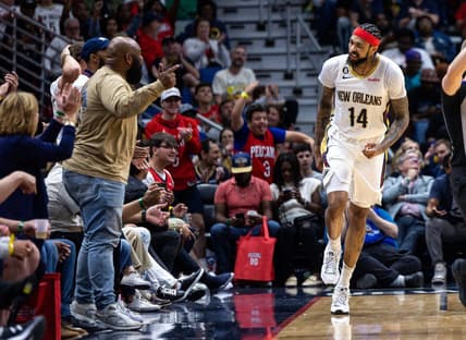 Apr 1, 2023; New Orleans, Louisiana, USA;  New Orleans Pelicans forward Brandon Ingram (14) reacts to making a basket against LA Clippers forward Kawhi Leonard (2) with a fan during the second half at Smoothie King Center. Mandatory Credit: Stephen Lew-USA TODAY Sports