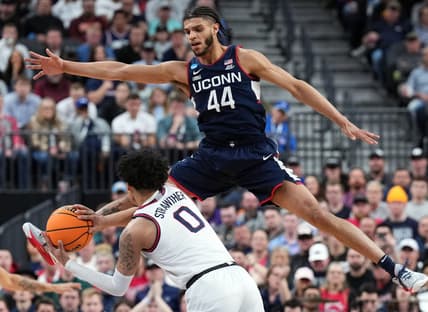 Mar 25, 2023; Las Vegas, NV, USA; Connecticut Huskies guard Andre Jackson Jr. (44) defends against Gonzaga Bulldogs guard Julian Strawther (0) during the second half for the NCAA tournament West Regional final at T-Mobile Arena. Mandatory Credit: Joe Camporeale-USA TODAY Sports at T-Mobile Arena. Mandatory Credit: Joe Camporeale-USA TODAY Sports