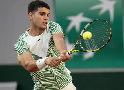 May 29, 2023; Paris,France; Carlos Alcaraz (ESP) returns a shot during his match against Flavio Cobolli (ITA) on day two at Stade Roland-Garros. Mandatory Credit: Susan Mullane-USA TODAY Sports