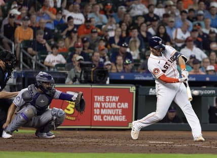 Jul 5, 2023; Houston, Texas, USA; Houston Astros catcher Yainer Diaz (21) hits a two run home run against the Colorado Rockies in the fourth inning at Minute Maid Park. Mandatory Credit: Thomas Shea-USA TODAY Sports