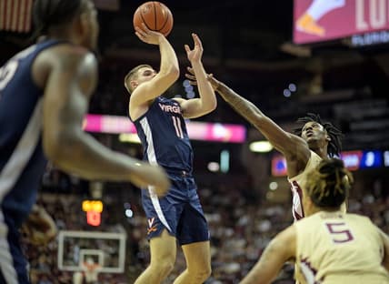 Feb 10, 2024; Tallahassee, Florida, USA; Virginia Cavaliers guard Isaac McKneely (11) shoots the ball over Florida State Seminoles forward Jamir Watkins (2) during the first half at Donald L. Tucker Center. Mandatory Credit: Melina Myers-USA TODAY Sports
