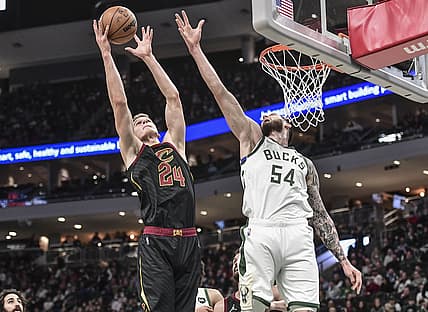 Dec 18, 2021; Milwaukee, Wisconsin, USA;  Cleveland Cavaliers forward Lauri Markkanen (24) shoots the ball against Milwaukee Bucks forward Sandro Mamukelashvili (54) in the second quarter at Fiserv Forum. Mandatory Credit: Benny Sieu-USA TODAY Sports