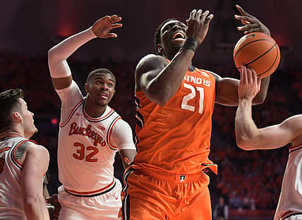 Feb 24, 2022; Champaign, Illinois, USA;  Illinois Fighting Illini center Kofi Cockburn (21) tries to gain possession of the ball in front of Ohio State Buckeyes forward E.J. Liddell (32) during the first half at State Farm Center. Mandatory Credit: Ron Johnson-USA TODAY Sports