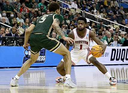 Mar 18, 2022; Pittsburgh, PA, USA; Houston Cougars guard Jamal Shead (1) dribbles against UAB Blazers forward KJ Buffen (5) in the second half during the first round of the 2022 NCAA Tournament at PPG Paints Arena. Mandatory Credit: Charles LeClaire-USA TODAY Sports