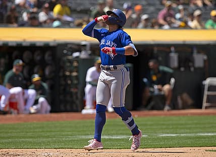 Jul 6, 2022; Oakland, California, USA; Toronto Blue Jays shortstop Bo Bichette (11) celebrates after hitting a solo home run against the Oakland Athletics during the eighth inning at RingCentral Coliseum. Mandatory Credit: D. Ross Cameron-USA TODAY Sports