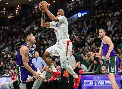Feb 2, 2023; Milwaukee, Wisconsin, USA; Los Angeles Clippers guard Norman Powell (24) shoots against Milwaukee Bucks guard Grayson Allen (12) in the second quarter at Fiserv Forum. Mandatory Credit: Benny Sieu-USA TODAY Sports