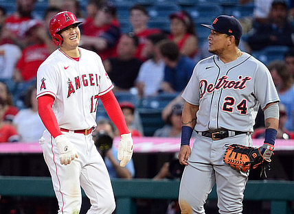 Jun 17, 2021; Anaheim, California, USA; Los Angeles Angels starting pitcher Shohei Ohtani (17) speaks with Detroit Tigers first baseman Miguel Cabrera (24) after reaching first on a walk during the fifth inning at Angel Stadium. Mandatory Credit: Gary A. Vasquez-USA TODAY Sports