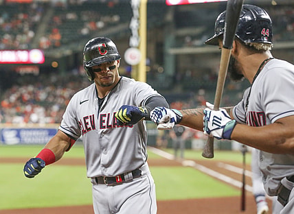 Jul 21, 2021; Houston, Texas, USA; Cleveland Indians designated hitter Bobby Bradley (44)  congratulates second baseman Cesar Hernandez (7) on his home run against the Houston Astros in the seventh inning at Minute Maid Park. Mandatory Credit: Thomas Shea-USA TODAY Sports