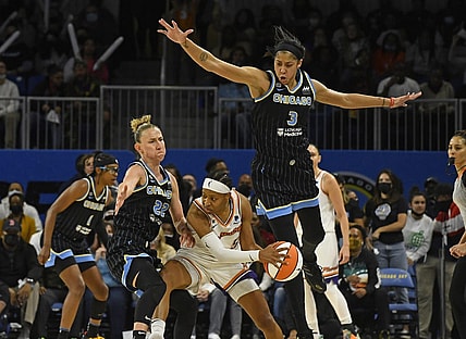 Oct 17, 2021; Chicago, Illinois, USA; Chicago Sky guard Courtney Vandersloot (22) and Chicago Sky forward/center Candace Parker (3) block Phoenix Mercury guard Shey Peddy (5) during the second half of game four of the 2021 WNBA Finals at Wintrust Arena. Mandatory Credit: Matt Marton-USA TODAY Sports