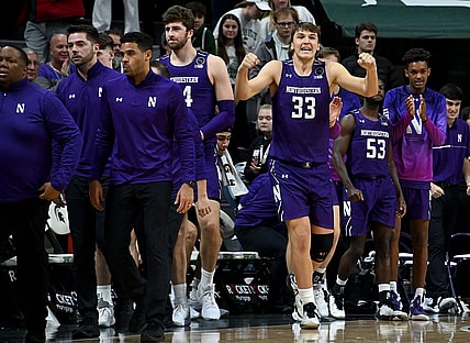 Dec 4, 2022; East Lansing, Michigan, USA; Northwestern Wildcats forward Luke Hunger (33) celebrates their win against the Michigan State Spartans at Jack Breslin Student Events Center. Mandatory Credit: Dale Young-USA TODAY Sports