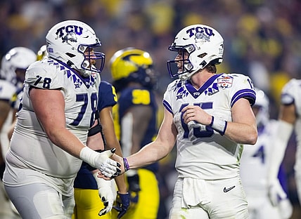Dec 31, 2022; Glendale, Arizona, USA; TCU Horned Frogs offensive lineman Wes Harris (78) celebrates a touchdown with quarterback Max Duggan (15) against the Michigan Wolverines during the 2022 Fiesta Bowl at State Farm Stadium. Mandatory Credit: Mark J. Rebilas-USA TODAY Sports