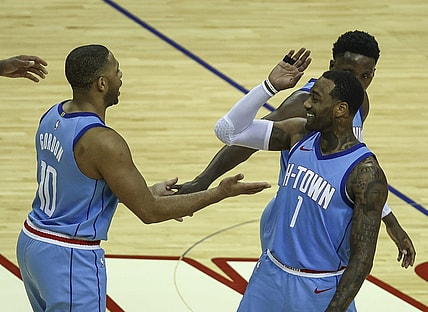 Jan 28, 2021; Houston, Texas, USA; Houston Rockets guard Eric Gordon (10) and guard John Wall (1) celebrate after a play during the fourth quarter against the Portland Trail Blazers at Toyota Center. Mandatory Credit: Troy Taormina-USA TODAY Sports