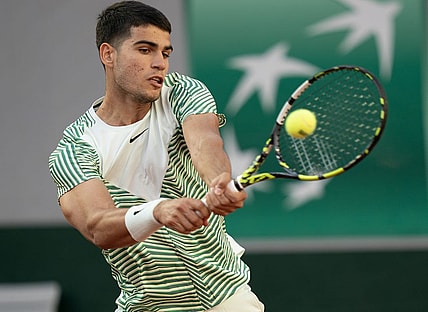 May 29, 2023; Paris,France; Carlos Alcaraz (ESP) returns a shot during his match against Flavio Cobolli (ITA) on day two at Stade Roland-Garros. Mandatory Credit: Susan Mullane-USA TODAY Sports