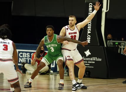 Mar 13, 2021; Frisco, TX, USA; North Texas Mean Green guard Javion Hamlet (3) guards Western Kentucky Hilltoppers forward Carson Williams (22) during the first half at Ford Center at The Star. Mandatory Credit: Tim Heitman-USA TODAY Sports