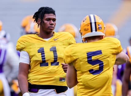 Apr 17, 2021; Baton Rouge, Louisiana, USA;  LSU Tigers quarterback TJ Finley (11) warms up with LSU Tigers quarterback Garrett Nussmeier (5) on the sidelines during the first half of the annual Purple and White spring game at Tiger Stadium. Mandatory Credit: Stephen Lew-USA TODAY Sports