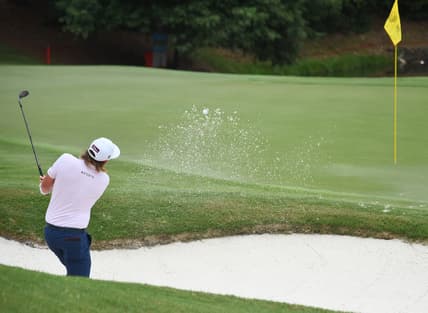 Aug 6, 2021; Memphis, Tennessee, USA; Cameron Smith makes a shot from the bunker on the third hole during the second round of the WGC FedEx St. Jude Invitational golf tournament at TPC Southwind. Mandatory Credit: Christopher Hanewinckel-USA TODAY Sports