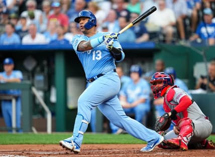 Aug 11, 2023; Kansas City, Missouri, USA; Kansas City Royals catcher Salvador Perez (13) hits an RBI double against the St. Louis Cardinals during the first inning at Kauffman Stadium. Mandatory Credit: Jay Biggerstaff-USA TODAY Sports
