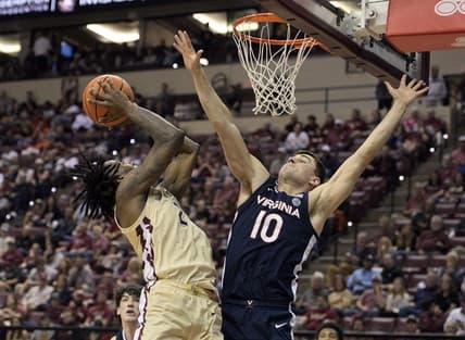 Feb 10, 2024; Tallahassee, Florida, USA; Virginia Cavaliers guard Taine Murray (10) defends the shot of Florida State Seminoles forward Jamir Watkins (2) during the second half at Donald L. Tucker Center. Mandatory Credit: Melina Myers-USA TODAY Sports