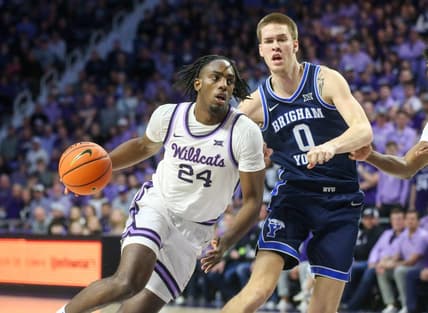 Feb 24, 2024; Manhattan, Kansas, USA; Kansas State Wildcats forward Arthur Kaluma (24) drives to the basket against Brigham Young Cougars forward Noah Waterman (0) duering the first half at Bramlage Coliseum. Mandatory Credit: Scott Sewell-USA TODAY Sports