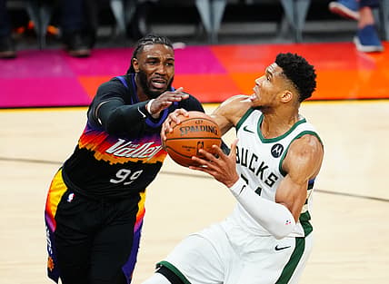 Jul 8, 2021; Phoenix, Arizona, USA; Milwaukee Bucks forward Giannis Antetokounmpo (34) against Phoenix Suns forward Jae Crowder (99) in game two of the 2021 NBA Finals at Phoenix Suns Arena. Mandatory Credit: Mark J. Rebilas-USA TODAY Sports