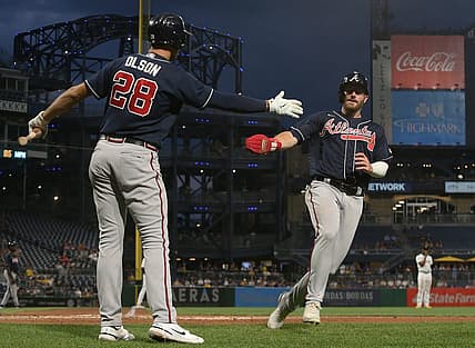 Aug 23, 2022; Pittsburgh, Pennsylvania, USA; Atlanta Braves first baseman Matt Olson (28) greets left fielder Robbie Grossman (right) after Grossman scored a run against the Pittsburgh Pirates during the fifth inning at PNC Park. Mandatory Credit: Charles LeClaire-USA TODAY Sports