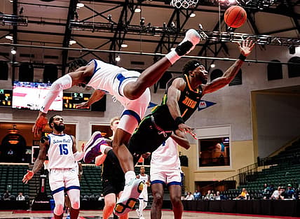 Nov 27, 2022; Orlando, FL, USA; Siena Saints guard Jared Billups (1) shoots against Seton Hall Pirates forward KC Ndefo (13) during the first half at ESPN Wide World of Sports. Mandatory Credit: Rich Storry-USA TODAY Sports