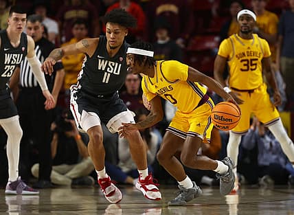 Jan 5, 2023; Tempe, Arizona, USA; Arizona State Sun Devils guard DJ Horne (0) against Washington State Cougars forward DJ Rodman (11) in the first half at Desert Financial Arena. Mandatory Credit: Mark J. Rebilas-USA TODAY Sports