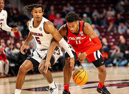 Jan 17, 2023; Columbia, South Carolina, USA; South Carolina Gamecocks guard Meechie Johnson (5) and Mississippi Rebels guard Matthew Murrell (11) battle for a loose ball in the first half at Colonial Life Arena. Mandatory Credit: Jeff Blake-USA TODAY Sports