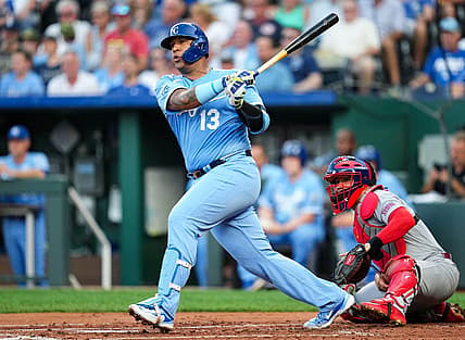 Aug 11, 2023; Kansas City, Missouri, USA; Kansas City Royals catcher Salvador Perez (13) hits an RBI double against the St. Louis Cardinals during the first inning at Kauffman Stadium. Mandatory Credit: Jay Biggerstaff-USA TODAY Sports