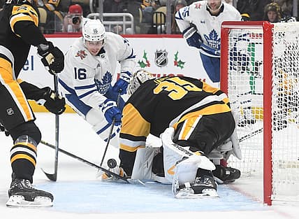 Nov 25, 2023; Pittsburgh, Pennsylvania, USA; Pittsburgh Penguins goalie Tristan Jarry (35) stops Toronto Maple Leafs right wing Mitchell Marner (16) during the second period at PPG Paints Arena. Mandatory Credit: Philip G. Pavely-USA TODAY Sports
