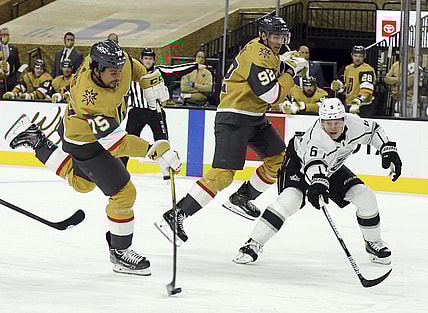 Feb 7, 2021; Las Vegas, NV, USA; Vegas Golden Knights right wing Ryan Reaves (75) shoots as Los Angeles Kings Olli Maatta (6) defends during the second period of an NHL hockey game Sunday, Feb. 7, 2021, in Las Vegas. Mandatory Credit: Isaac Brekken/Pool Photo-USA TODAY Sports