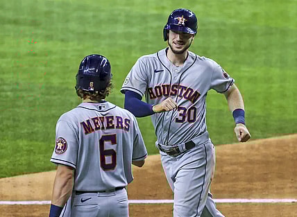 Sep 15, 2021; Arlington, Texas, USA;  Houston Astros right fielder Kyle Tucker (30) celebrates with center fielder Jake Meyers (6) after hitting a home run during the eighth inning against the Texas Rangers at Globe Life Field. Mandatory Credit: Kevin Jairaj-USA TODAY Sports