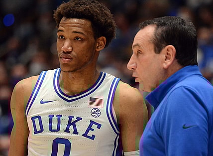 Feb 15, 2022; Durham, North Carolina, USA; Duke Blue Devils head coach Mike Krzyzewski (right) give instructions to  forward Wendell Moore Jr. (0) during the first half against the Wake Forest Demon Deacons at Cameron Indoor Stadium. Mandatory Credit: Rob Kinnan-USA TODAY Sports