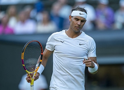Jul 4, 2022; London, United Kingdom; Rafael Nadal (ESP) reacts to a point during his match against Botic Van De Zandschulp (NED) on day eight at All England Lawn Tennis and Croquet Club. Mandatory Credit: Susan Mullane-USA TODAY Sports