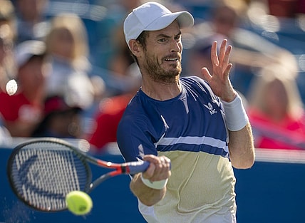 Aug 15, 2022; Cincinnati, OH, USA;  Andy Murray (GBR) returns a shot during his match against Stanislas Wawrinka (SUI) at the Western & Southern at the at the Lindner Family Tennis Center. Mandatory Credit: Susan Mullane-USA TODAY Sports