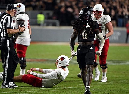 Sep 29, 2023; Raleigh, North Carolina, USA; North Carolina State Wolfpack safety Sean Brown (0) celebrates a sack during the second half against the Louisville Cardinals Mandatory Credit: Rob Kinnan-USA TODAY Sports at Carter-Finley Stadium. The Louisville Cardinals won 13-10.