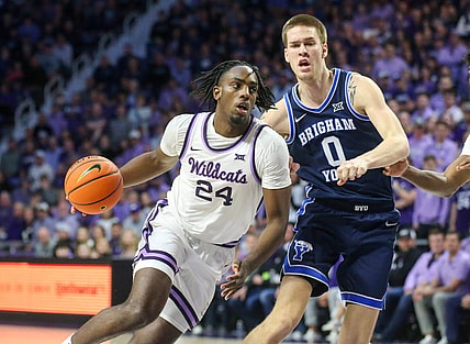 Feb 24, 2024; Manhattan, Kansas, USA; Kansas State Wildcats forward Arthur Kaluma (24) drives to the basket against Brigham Young Cougars forward Noah Waterman (0) duering the first half at Bramlage Coliseum. Mandatory Credit: Scott Sewell-USA TODAY Sports
