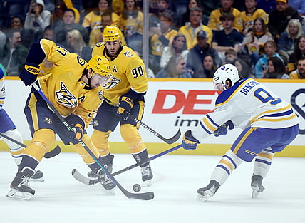 Mar 7, 2024; Nashville, Tennessee, USA; Nashville Predators defenseman Ryan McDonagh (27) breaks up an attack by Buffalo Sabres left wing Zach Benson (9) during their game at Bridgestone Arena. Mandatory Credit: Alan Poizner-USA TODAY Sports