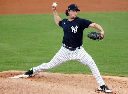 Mar 26, 2021; Tampa, Florida, USA;  New York Yankees starting pitcher Gerrit Cole (45) pitches in the first inning against the Baltimore Orioles during spring training at George M. Steinbrenner Field. Mandatory Credit: Nathan Ray Seebeck-USA TODAY Sports