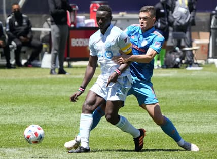 May 29, 2021; Chicago, Illinois, USA; Chicago Fire midfielder Luka Stojanovic (8) battles for the ball against Chicago Fire defender Boris Sekulic (2) during the first half at Soldier Field. Mandatory Credit: Mike Dinovo-USA TODAY Sports