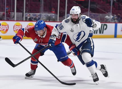 Jul 5, 2021; Montreal, Quebec, CAN; Montreal Canadiens left wing Artturi Lehkonen (62) skates against Tampa Bay Lightning right wing Nikita Kucherov (86) during the third period in game four of the 2021 Stanley Cup Final at the Bell Centre. Mandatory Credit: Eric Bolte-USA TODAY Sports