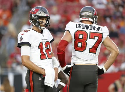 Aug 14, 2021; Tampa, Florida, USA; Tampa Bay Buccaneers quarterback Tom Brady (12) and tight end Rob Gronkowski (87) looks on against the Cincinnati Bengals during the first quarter at Raymond James Stadium. Mandatory Credit: Kim Klement-USA TODAY Sports